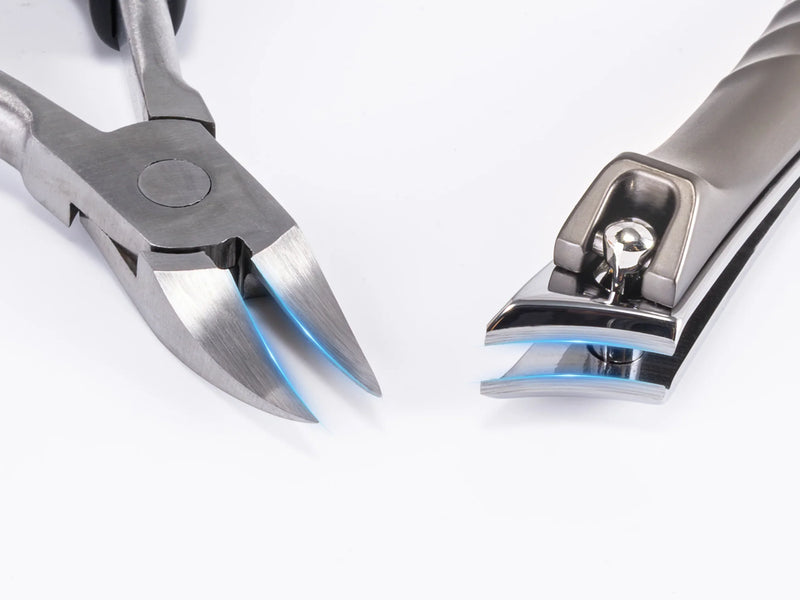 Two German style nail cutters displayed side by side: pointed tip model for ingrown nails and wide jaw clipper for thick toenails