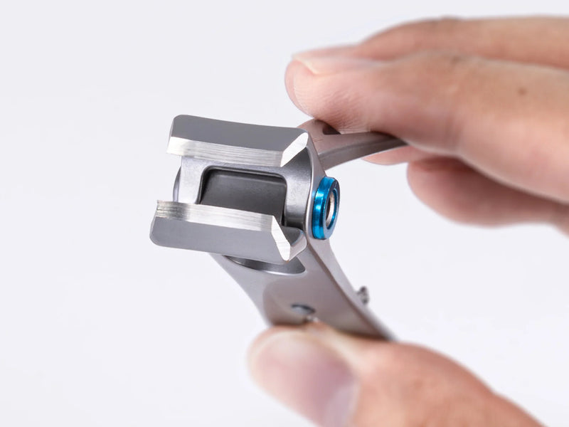 Macro shot revealing the surgical grade steel blade and cutting jaw of a heavy duty German nail clipper, highlighting precision craftsmanship